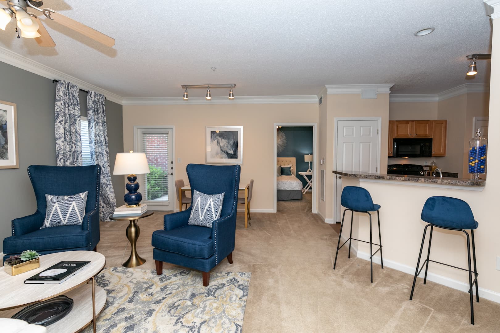model living and dining rooms with kitchen bar