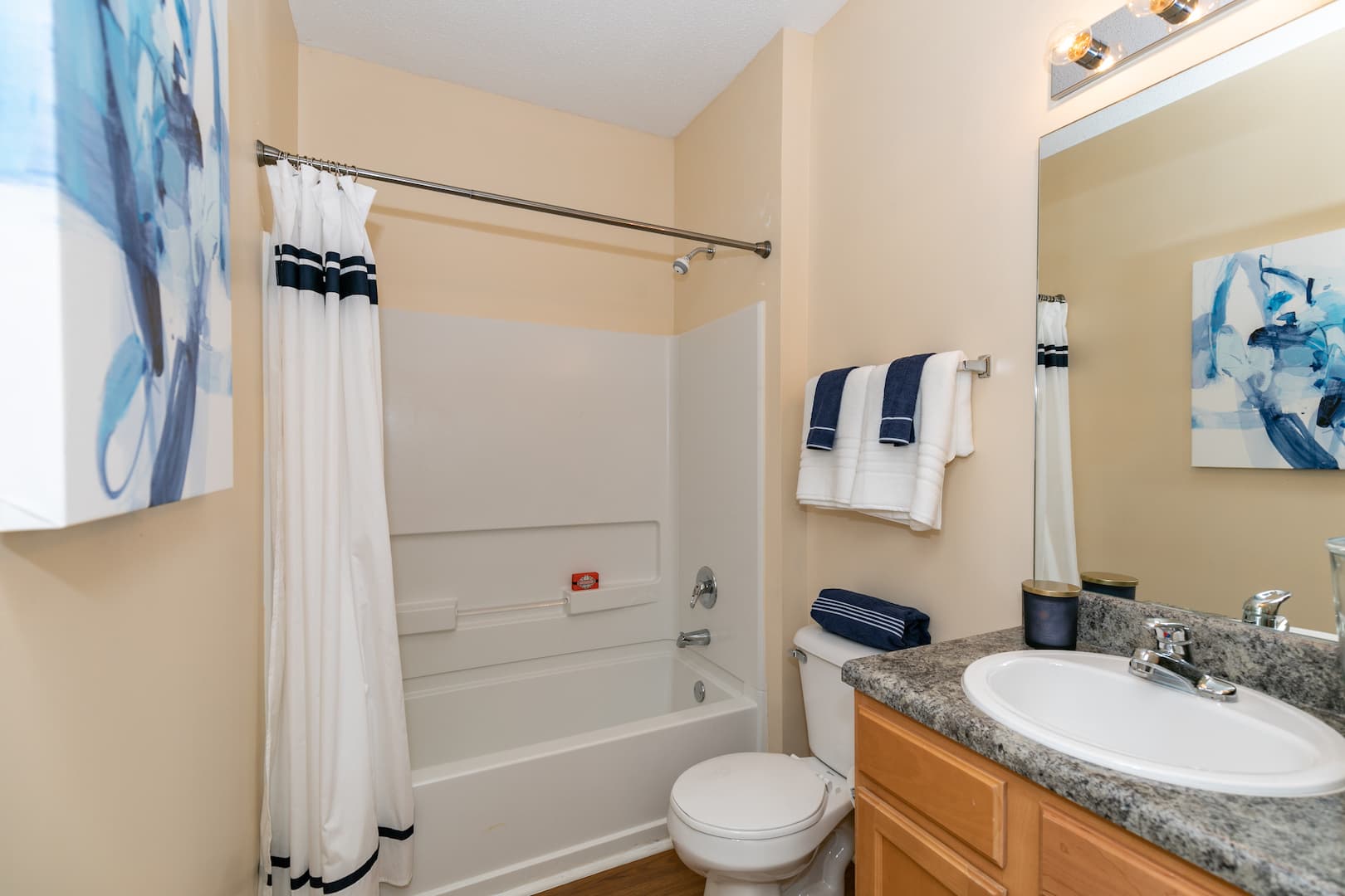 model bathroom with ample lighting and bathtub