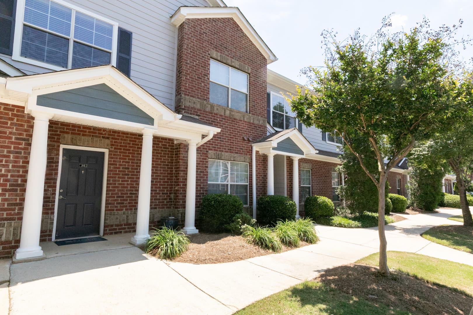 exterior view of apartment building and landscaping