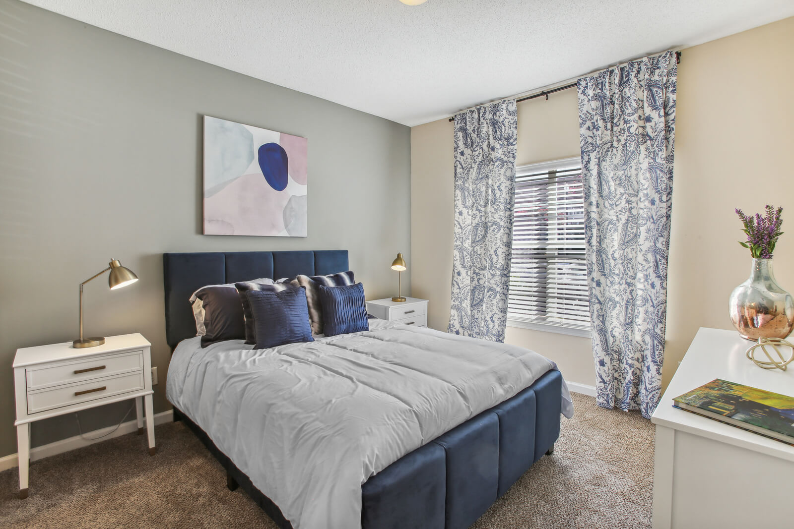 model carpeted bedroom ample lighting