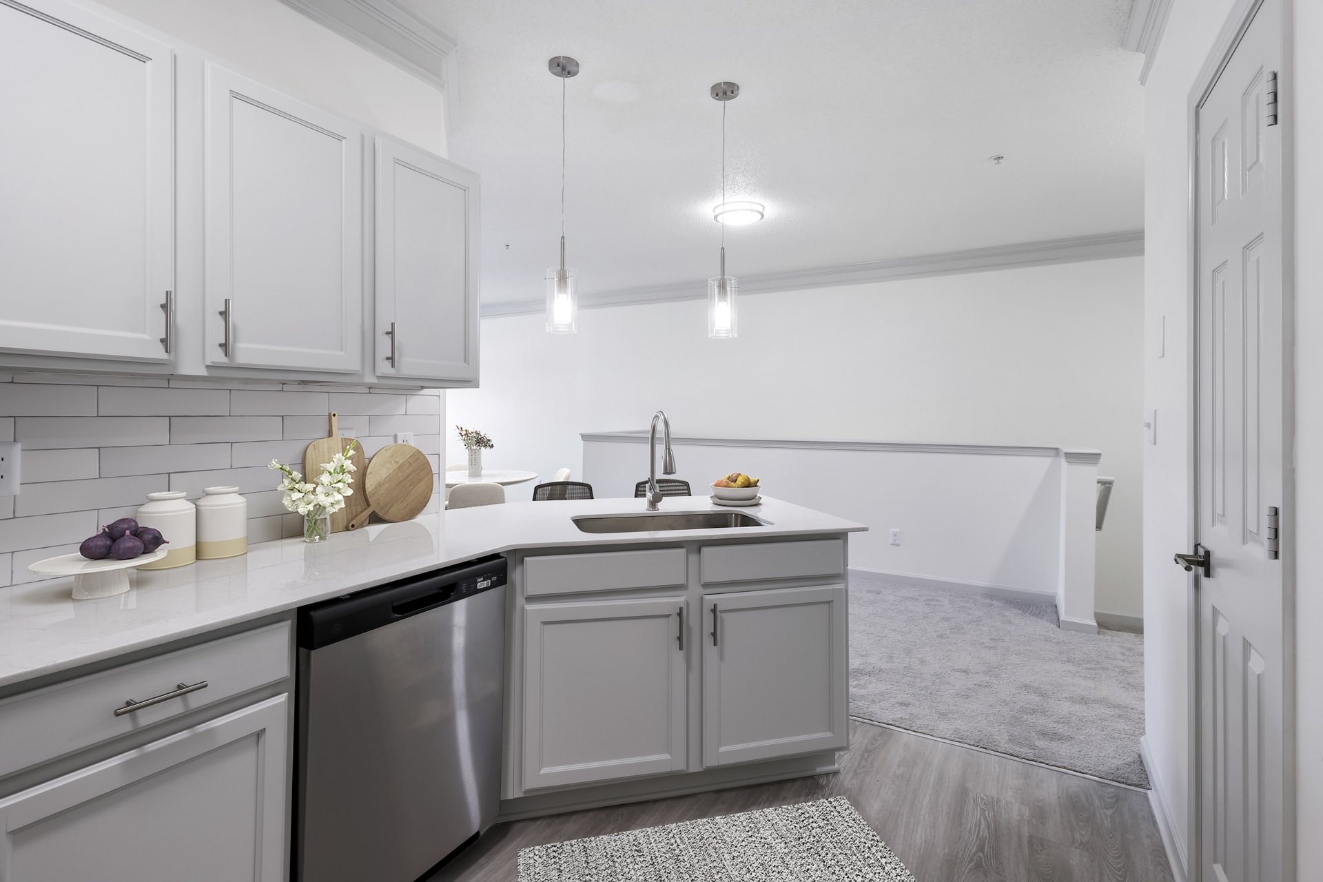 kitchen with white shaker cabinets with brushed nickel accents
