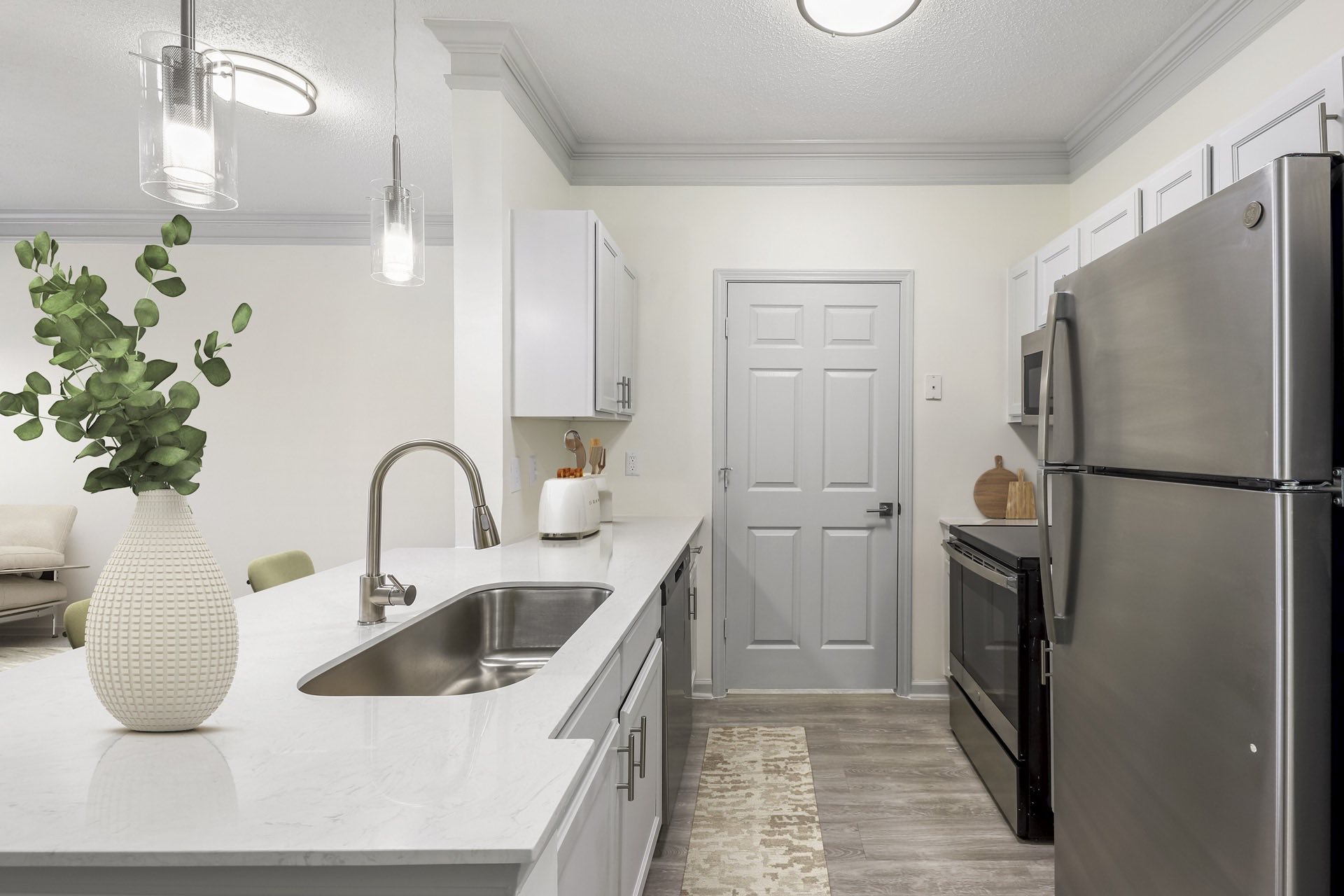 kitchen with large breakfast bar and modern pendant lighting