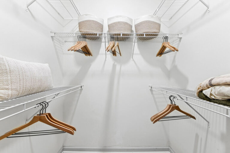 Staged walk-in closet.